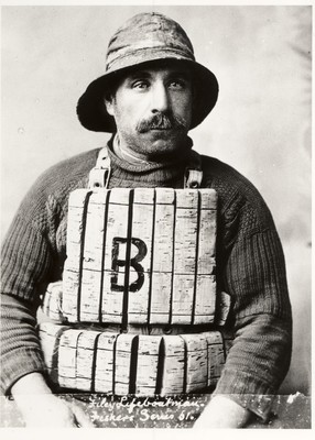 Jim Wheeler, fisherman & lifeboatman taken in studio, wearing old cork life jacket.